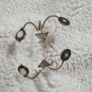 three gold bracelets